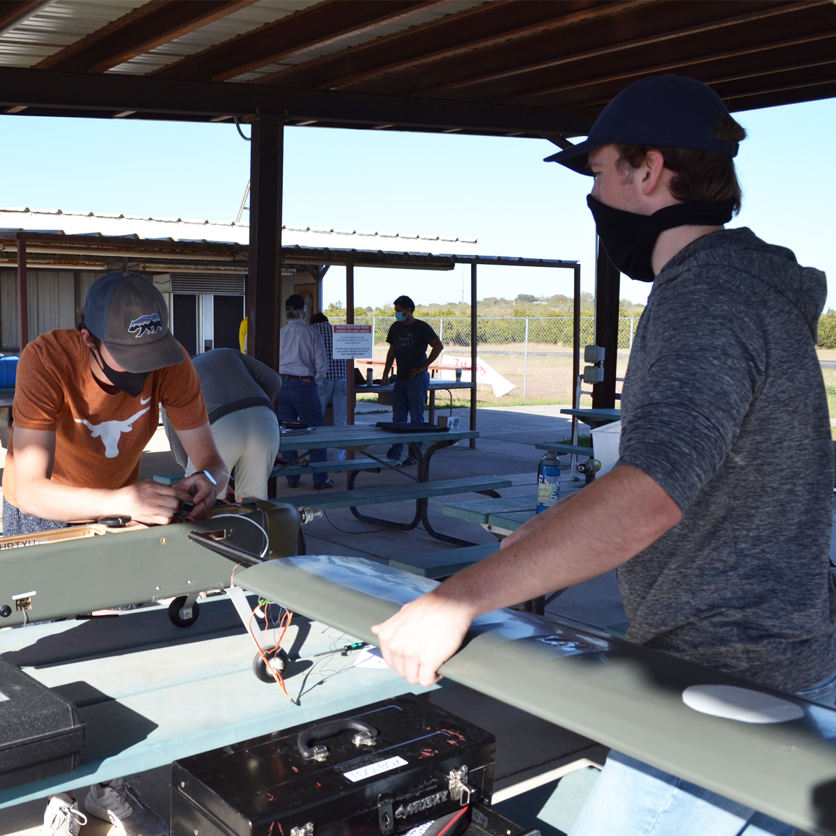 photo of students working on aircraft