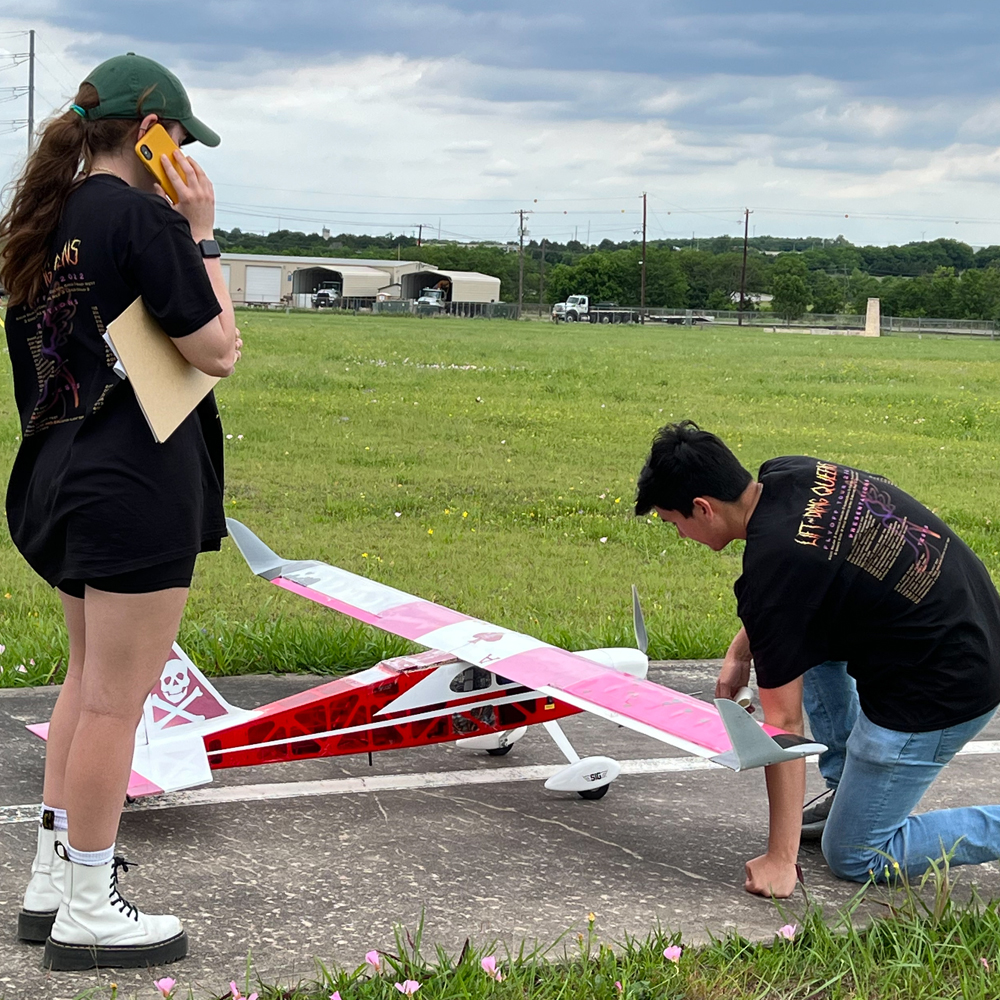 photo of students with aircraft